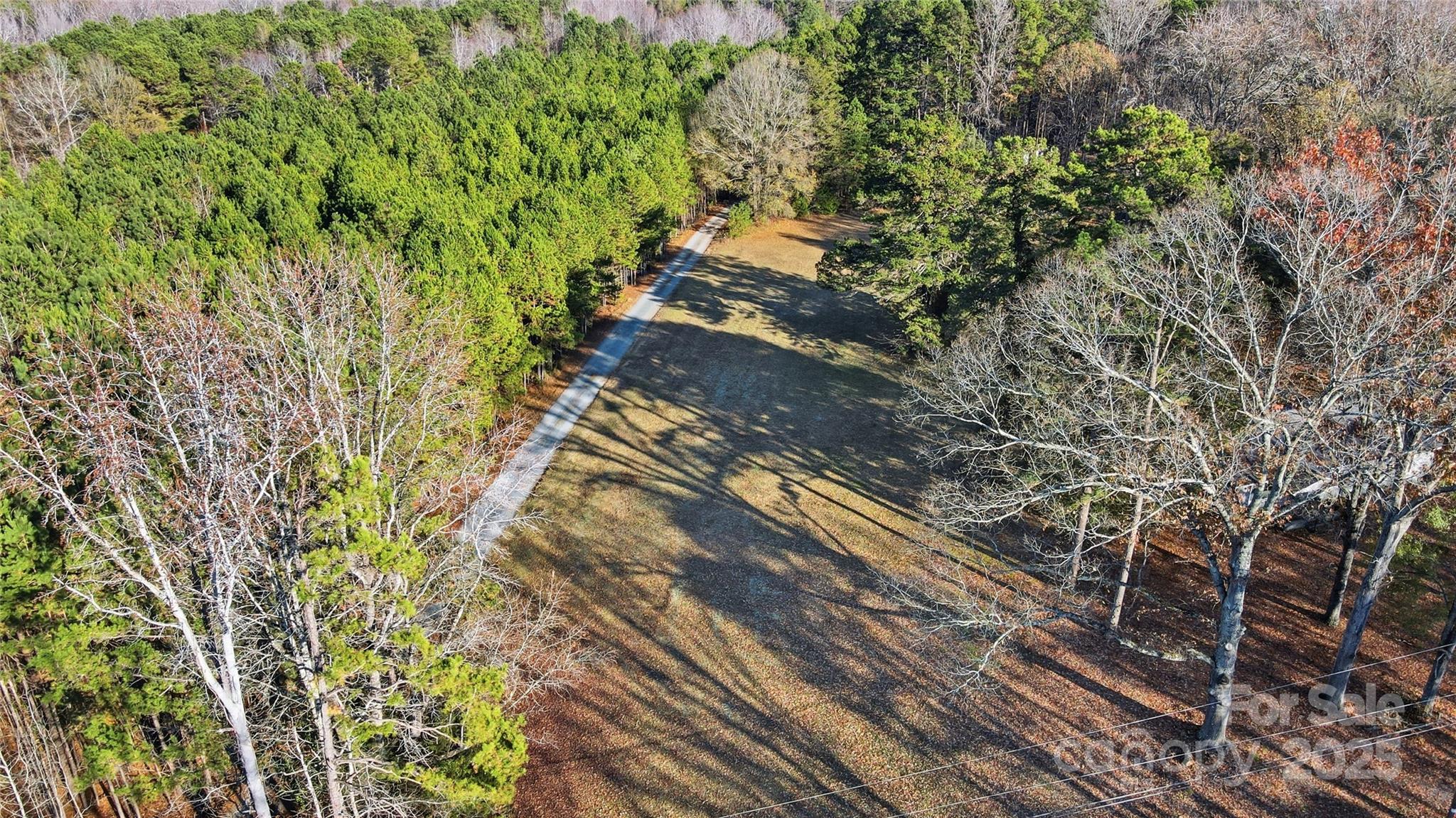 0 Fincher Road Matthews, NC 28104 - Photo 15 of 18 a view of a yard with plants and wooden fence