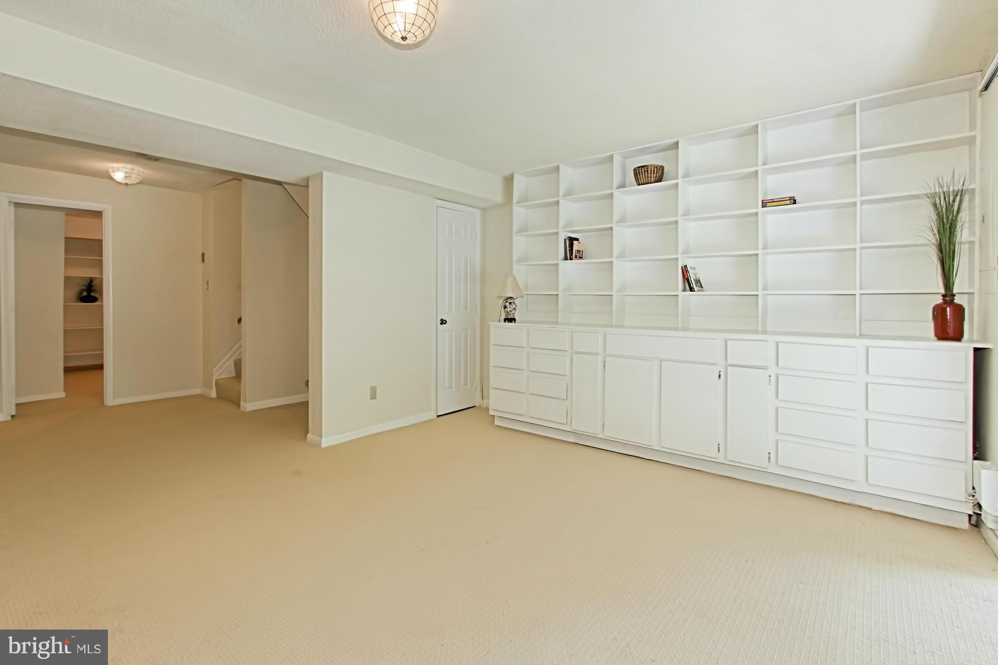1628 Oak Spring Way Reston, VA 20190 - Photo 24 of 30 Built-In Bookshelves in Recreation Room