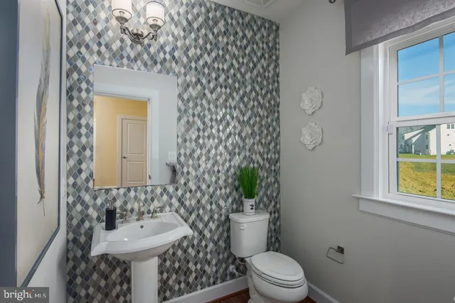 a spacious bedroom with a bed and a flat screen television