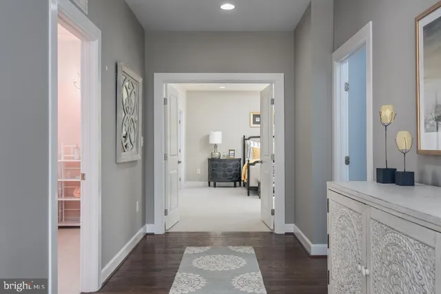 a room with pool table and windows