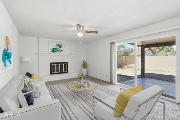 a bedroom with a bed couch and window