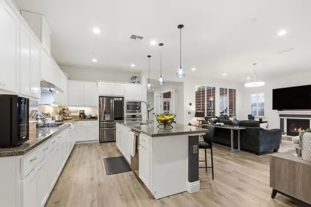 a view of swimming pool with seating area