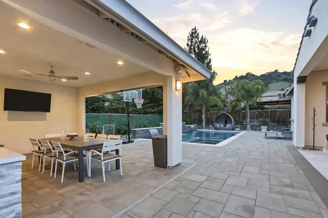 a bedroom with a bed and a potted plant