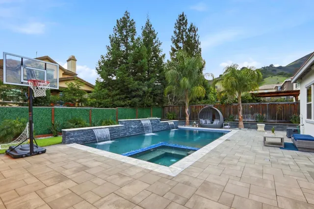 a bedroom with a large bed and a couch