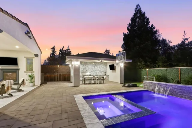 a view of a dining room with furniture large windows and wooden floor