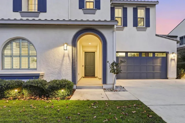 a view of a dining room with furniture wooden floor and chandelier