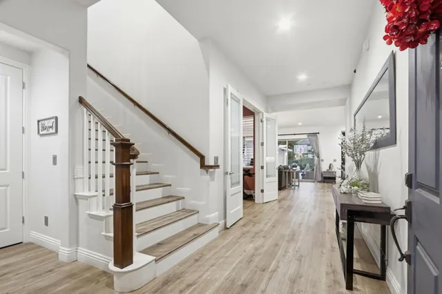 a large kitchen with stainless steel appliances kitchen island granite countertop a large island in the center