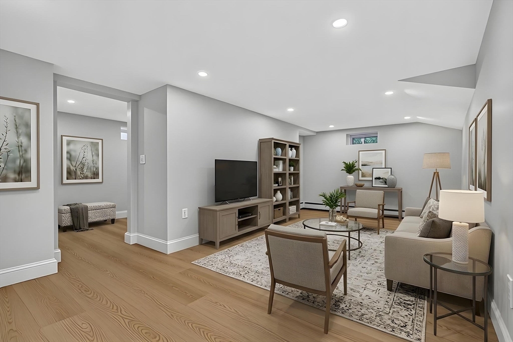 20 Saltonstall Road Medford, MA 02155 - Photo 36 of 41 a living room with furniture and a flat screen tv