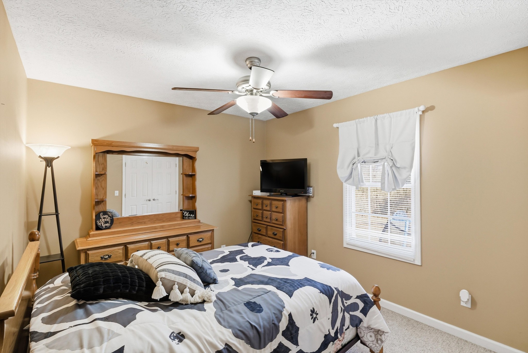 450 Poss Road Smithville, TN 37166 - Photo 14 of 33 a bedroom with a bed and a flat screen tv