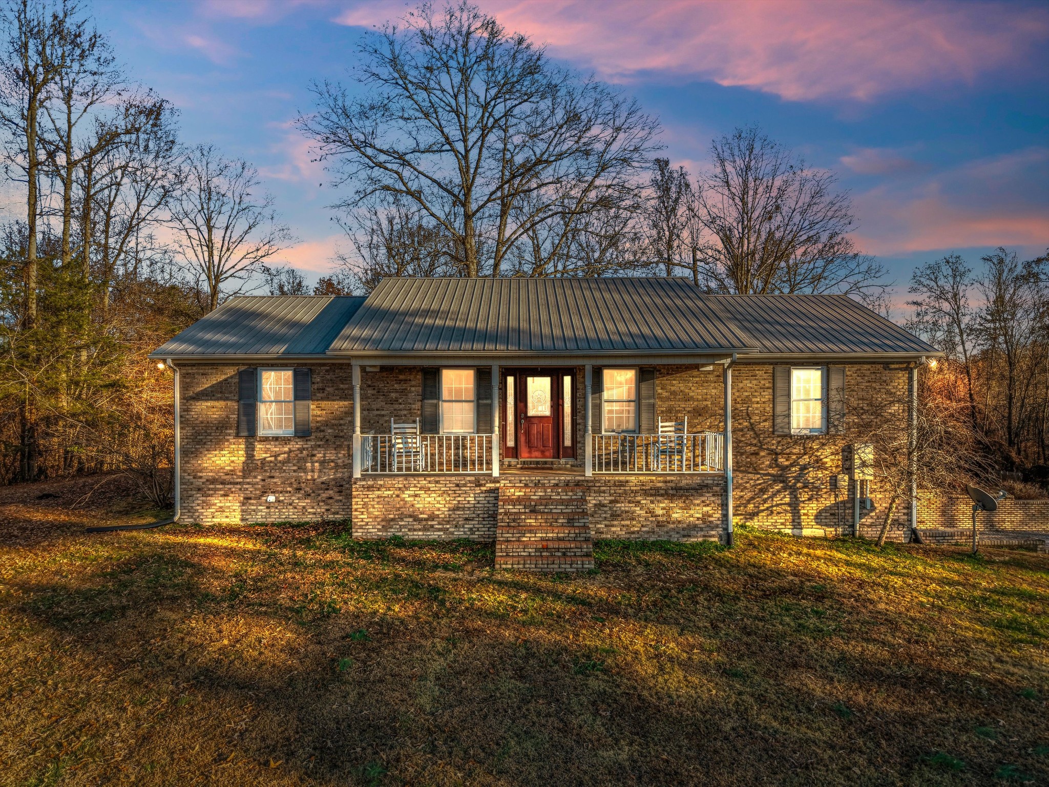 450 Poss Road Smithville, TN 37166 - Photo 2 of 33 a front view of a house with a yard