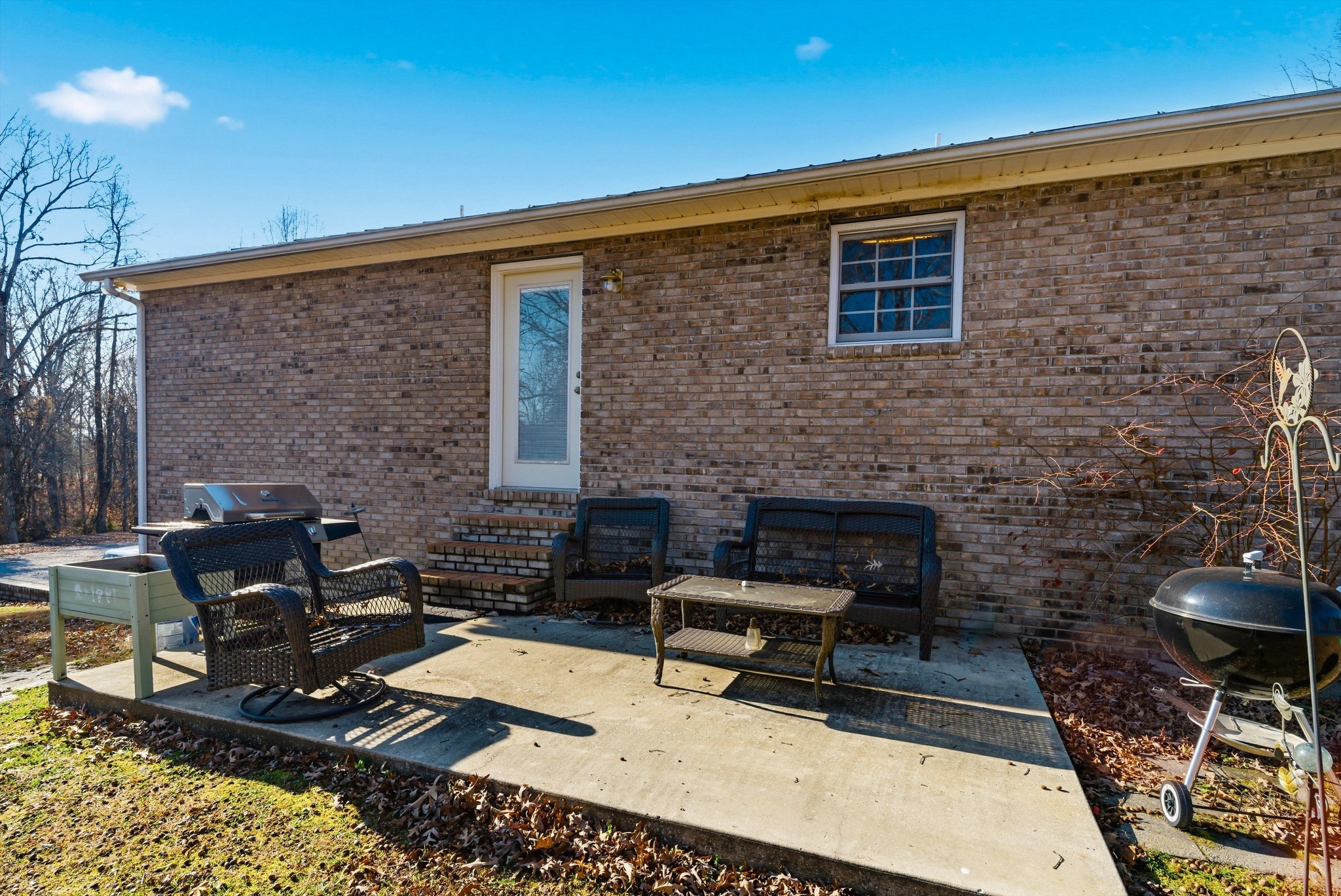 450 Poss Road Smithville, TN 37166 - Photo 21 of 33 a balcony with furniture and a fireplace
