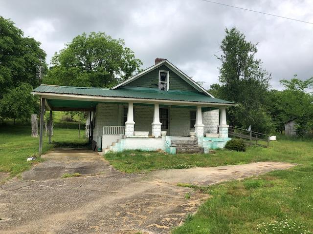 376 Ingram Road Pulaski, TN 38478 - Photo 1 of 5 a front view of a house with a yard porch and outdoor seating