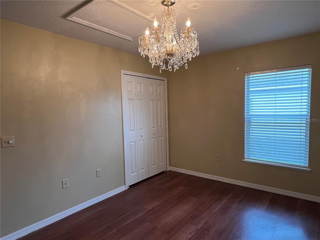 14367 Finsbury Drive Spring Hill, FL 34609 - Photo 31 of 35 a view of a chandelier in a room