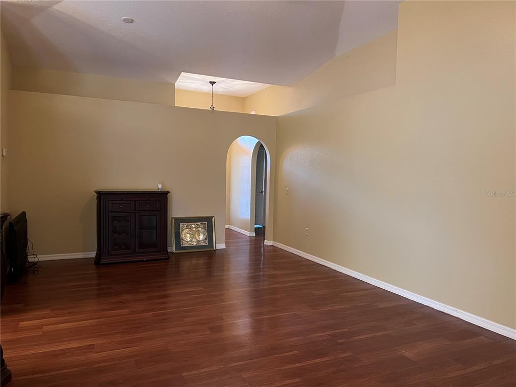 14367 Finsbury Drive Spring Hill, FL 34609 - Photo 9 of 35 a view of a livingroom with wooden floor