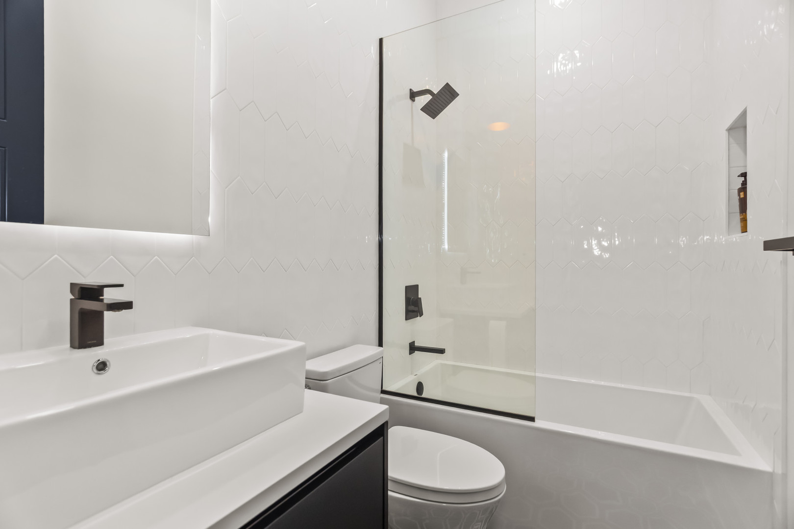 1425 West Fullerton Avenue, Unit 3N Chicago, IL 60614 - Photo 11 of 15 a bathroom with a sink a toilet and shower