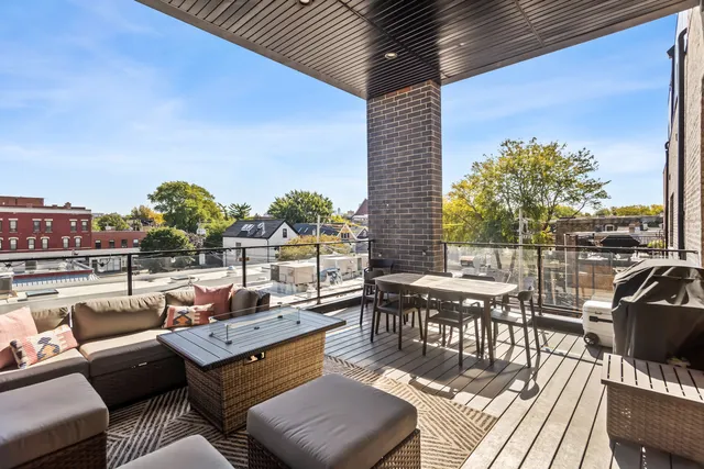 a outdoor space with patio couch and a potted plant