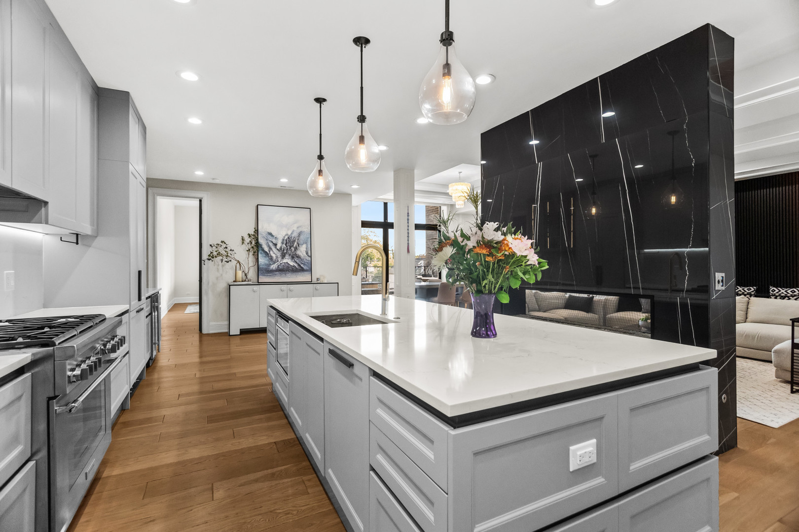 1425 West Fullerton Avenue, Unit 3N Chicago, IL 60614 - Photo 6 of 15 a large kitchen with kitchen island a sink and a stove