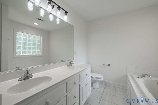 6118 Springwood Road Chester, VA 23831 - Photo 28 of 38 White dual vanity with integrated sinks and chrome