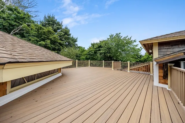 a view of a kitchen with refrigerator and cabinets
