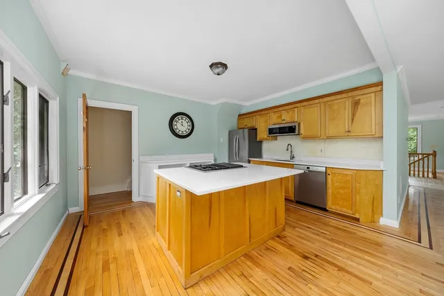 a room with a stove and a clock