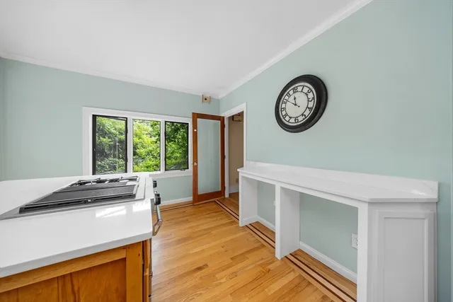 a kitchen with a stove a sink and a refrigerator