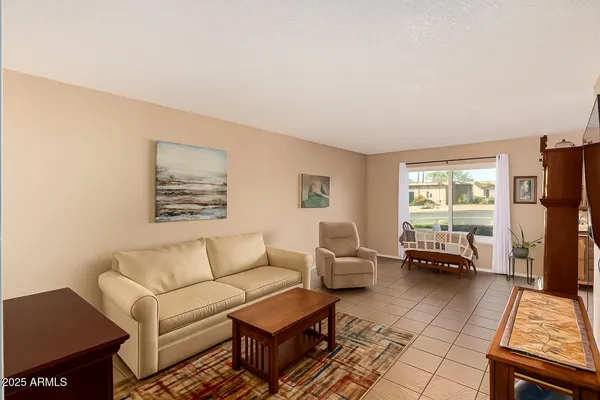 a living room with furniture and a window
