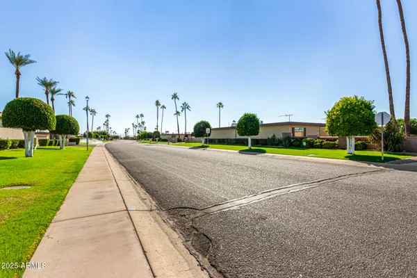 a view of a street with some trees