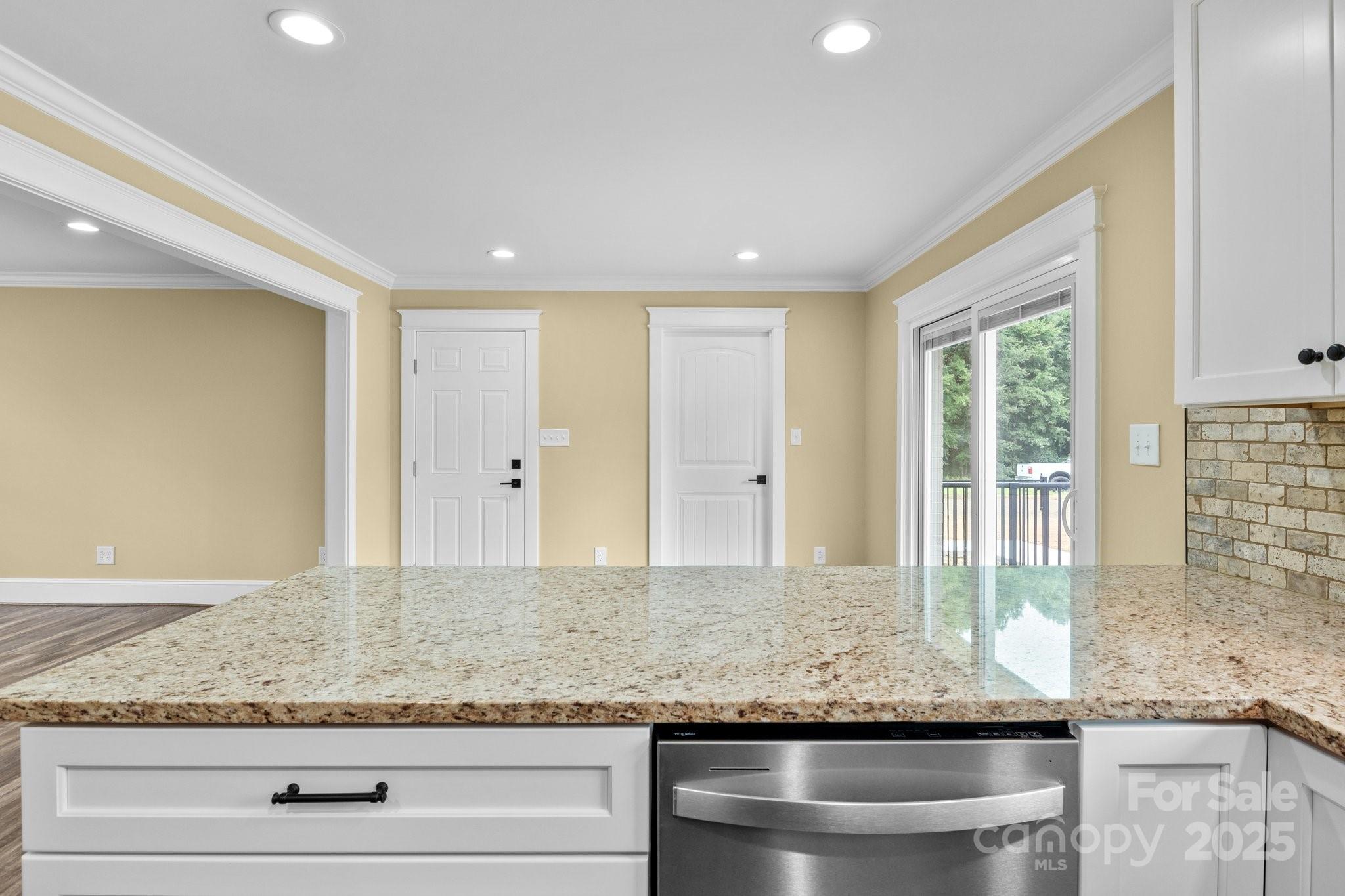 893 Chief Thomas Road Harmony, NC 28634 - Photo 12 of 38 a view of living room with granite countertop wooden floor