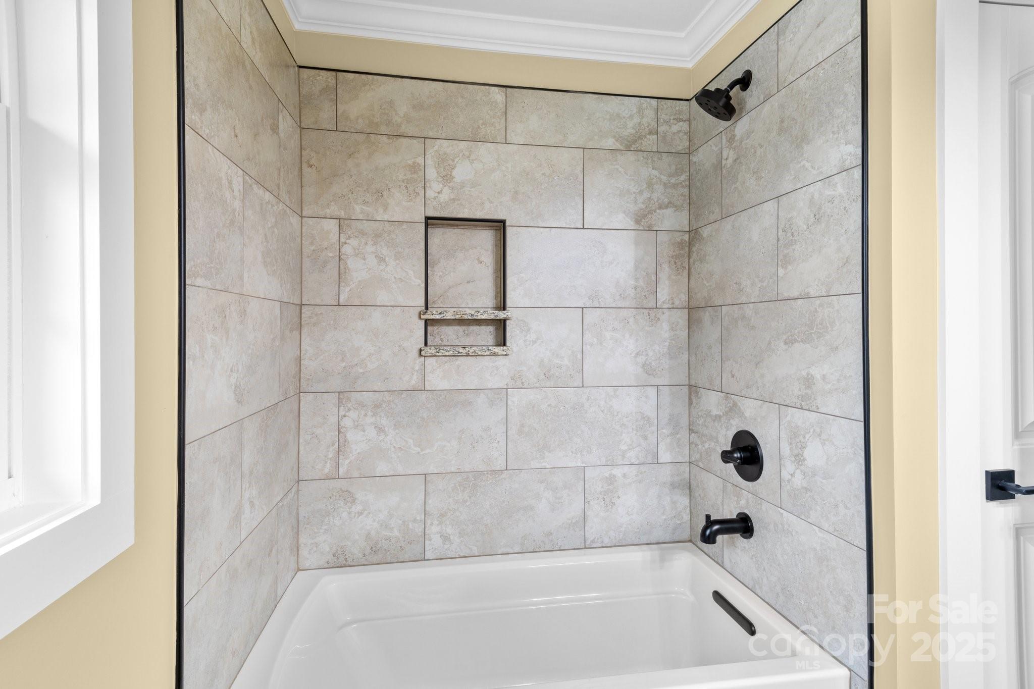 893 Chief Thomas Road Harmony, NC 28634 - Photo 20 of 38 a bathroom with a shower and a bath tub