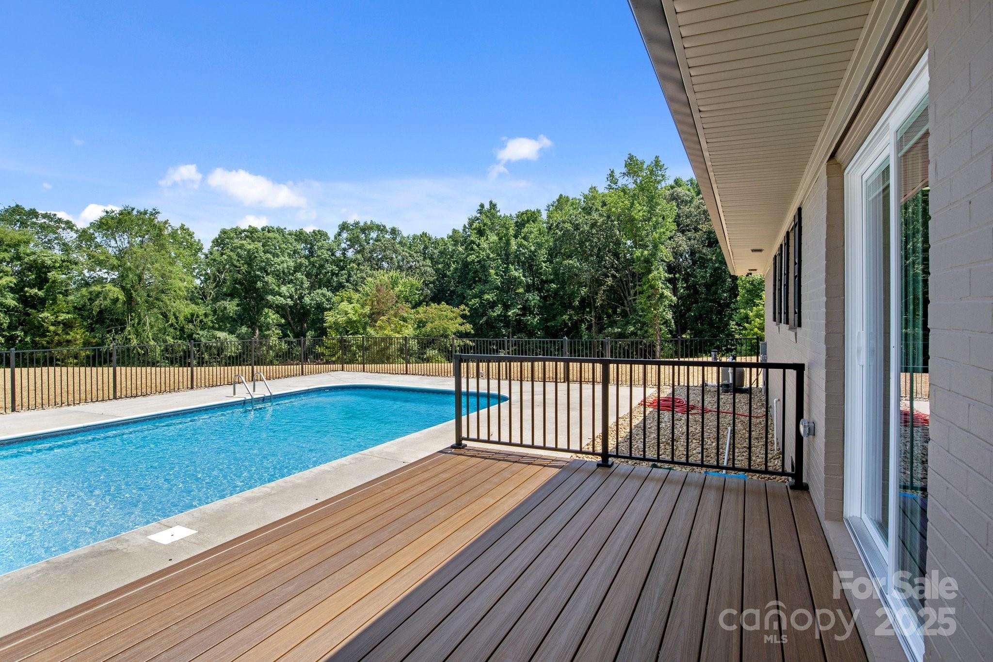 893 Chief Thomas Road Harmony, NC 28634 - Photo 29 of 38 a view of a balcony with wooden floor and fence