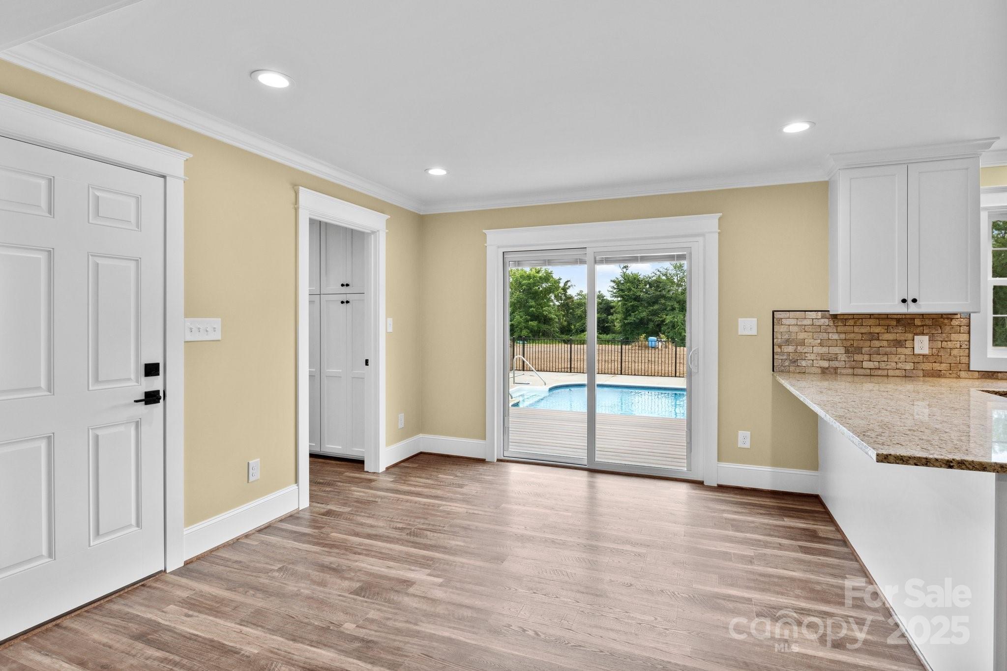 893 Chief Thomas Road Harmony, NC 28634 - Photo 7 of 38 a view of a kitchen with a stove and a kitchen