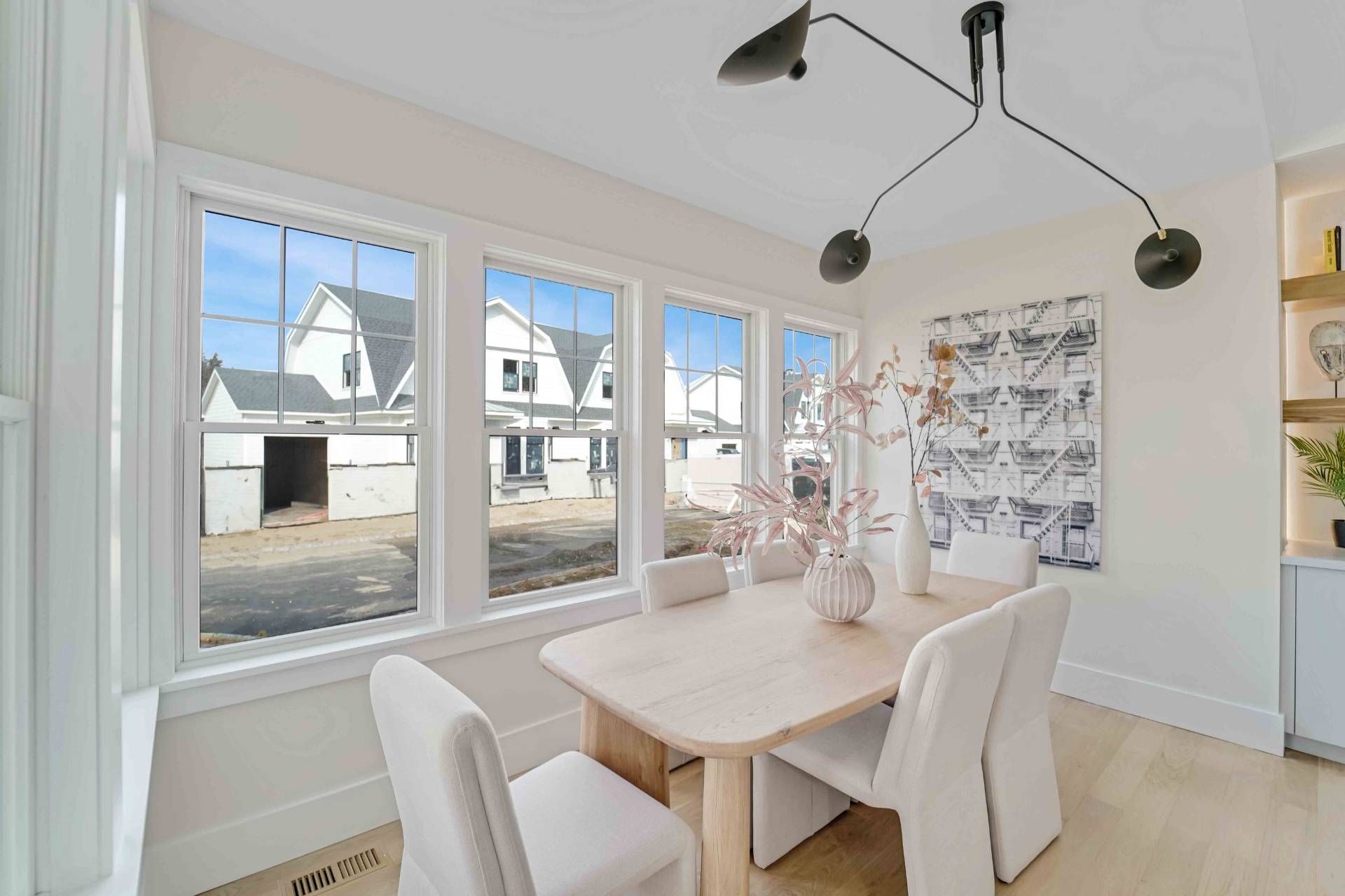 12 Depot Road, Unit 1502 Westhampton Beach, NY 11978 - Photo 16 of 26 a dining room with furniture a chandelier and window