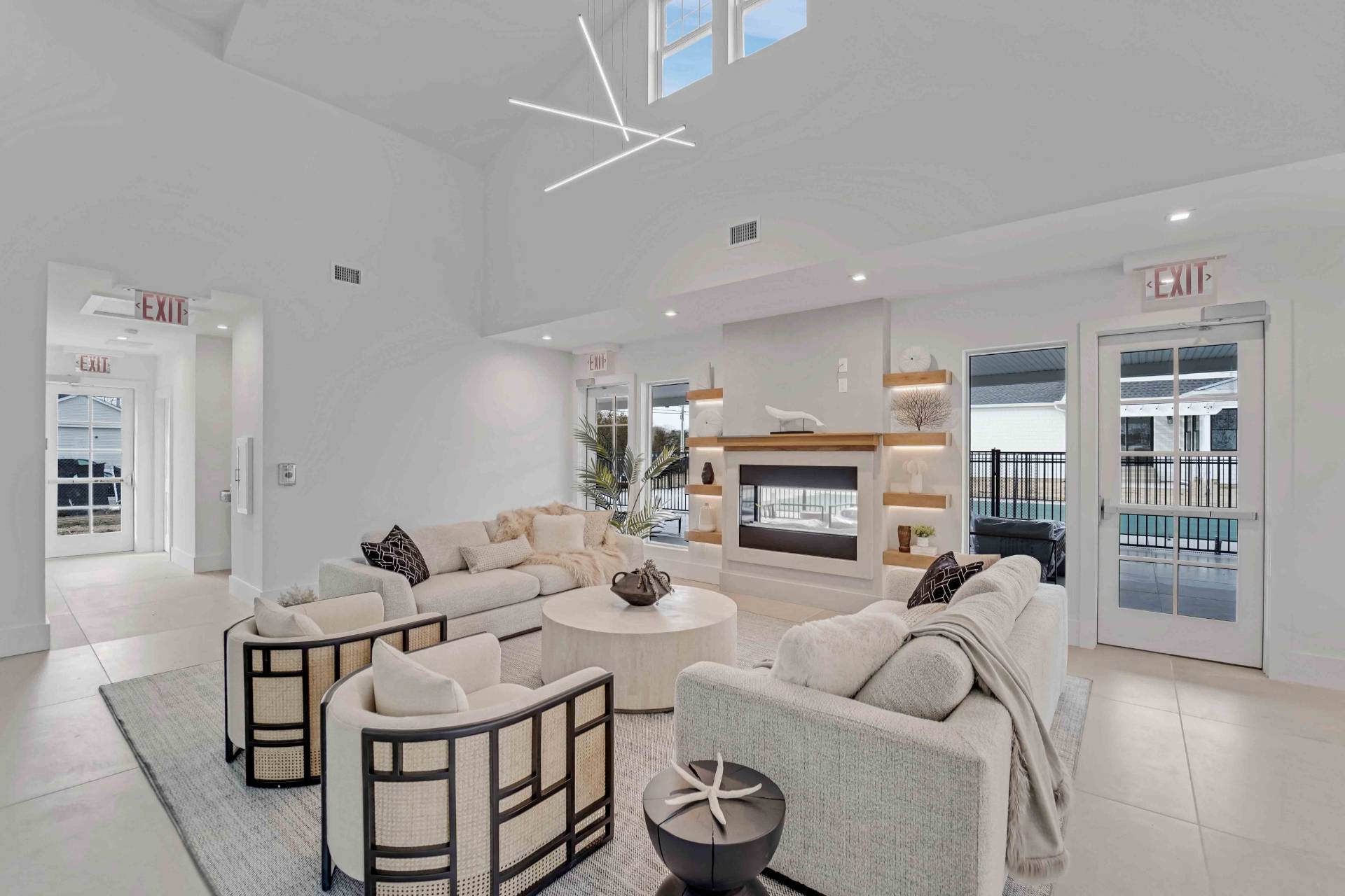 12 Depot Road, Unit 1502 Westhampton Beach, NY 11978 - Photo 6 of 26 a living room with furniture and a fireplace