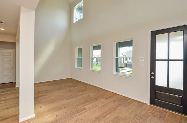 a large kitchen with a large counter top and stainless steel appliances