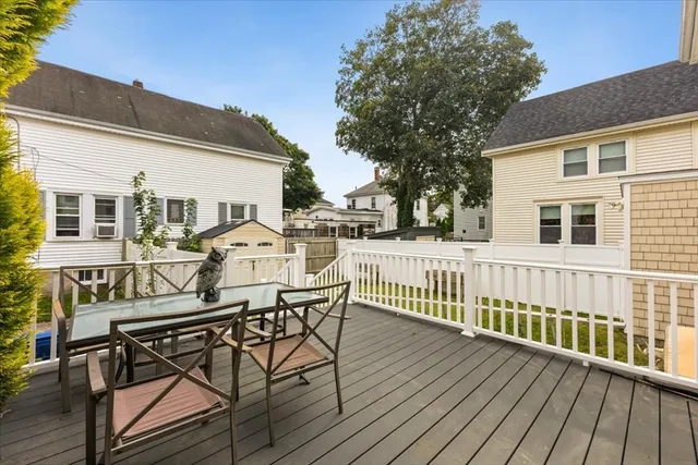 a view of a deck with table and chairs and wooden floor