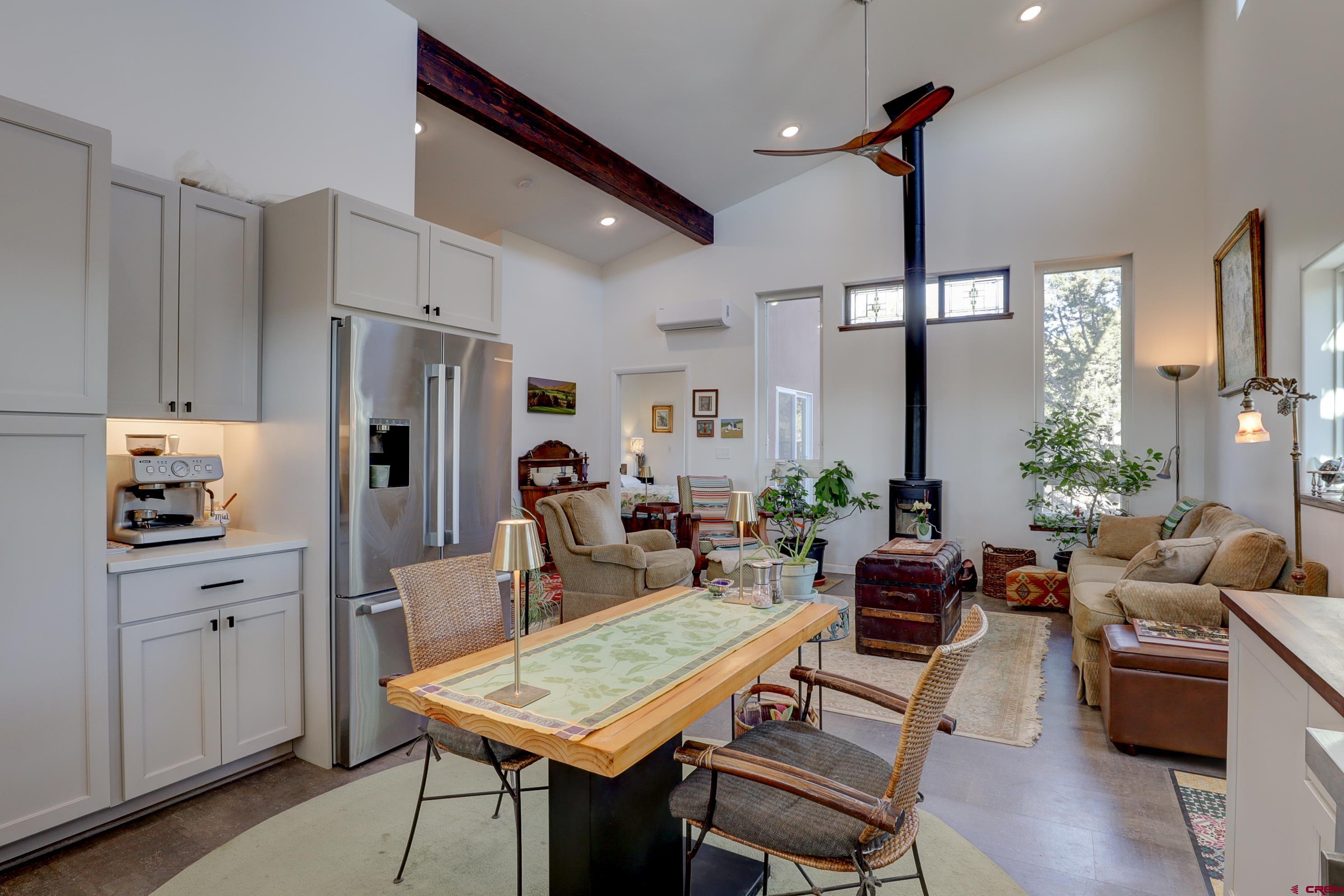 41839 Rd J.75 Mancos, CO 81328 - Photo 13 of 31 a living room with furniture kitchen view and a chandelier