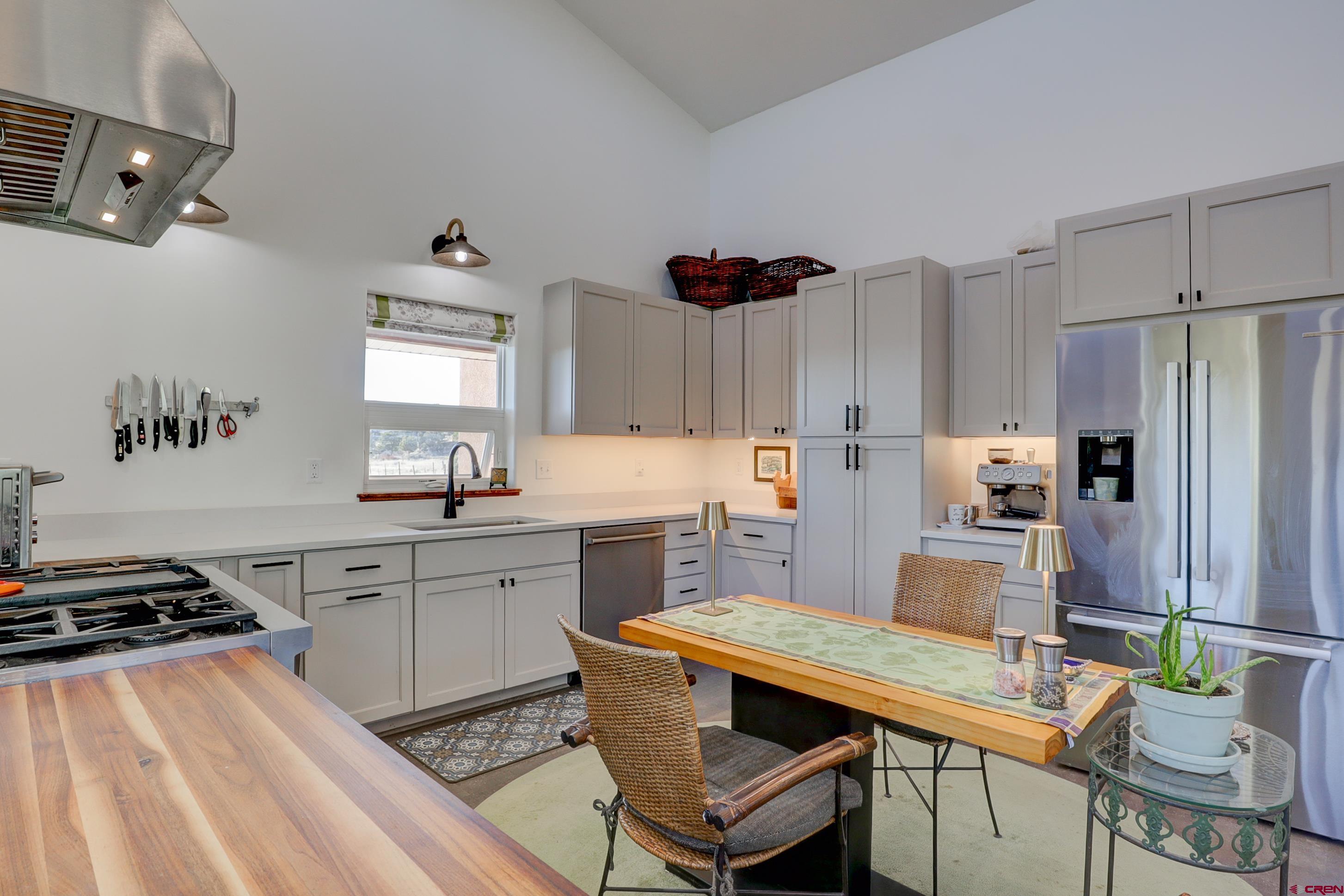 41839 Rd J.75 Mancos, CO 81328 - Photo 14 of 31 a kitchen with stainless steel appliances a stove a sink dishwasher and a refrigerator