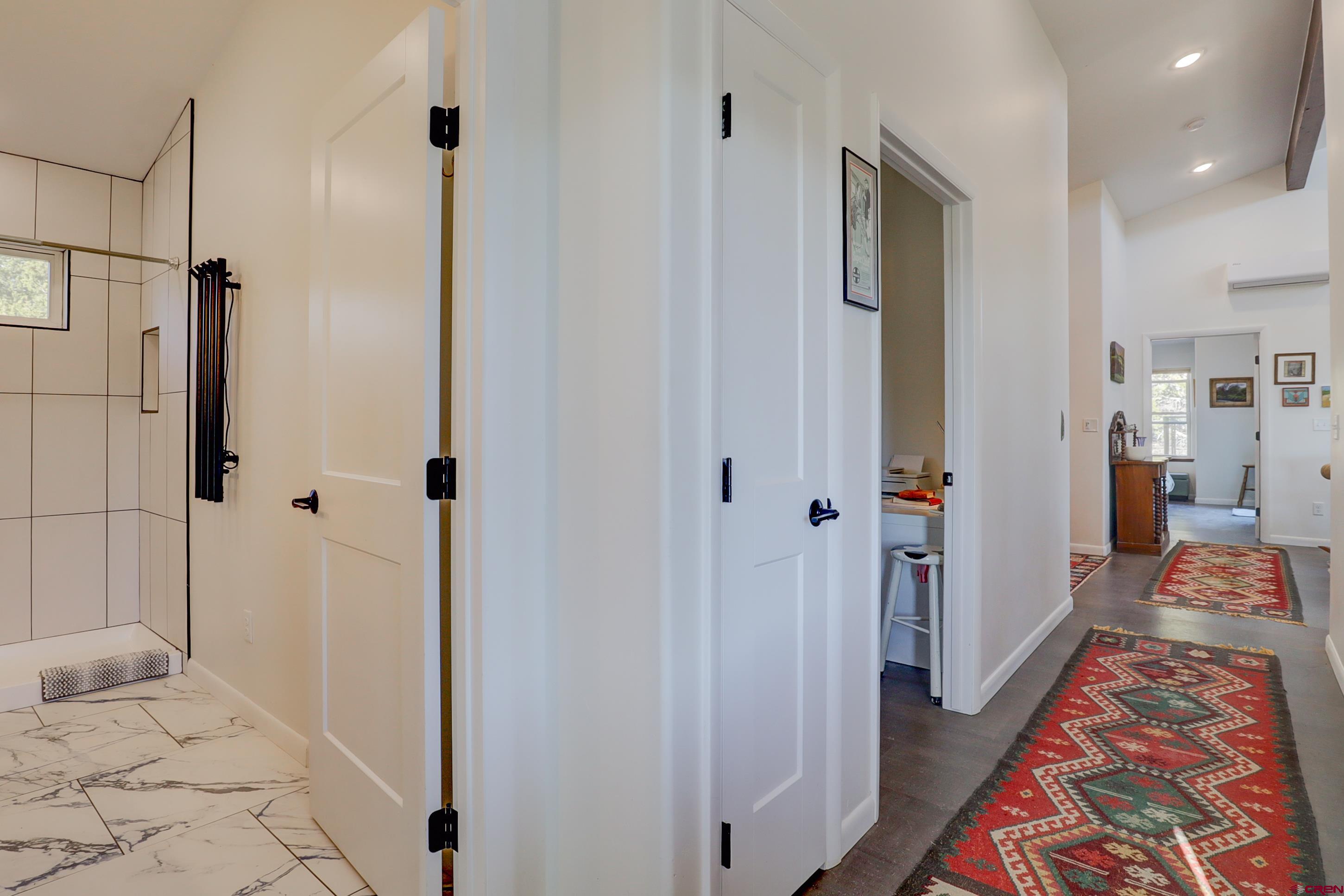 41839 Rd J.75 Mancos, CO 81328 - Photo 17 of 31 a bathroom with a bathtub and a shower