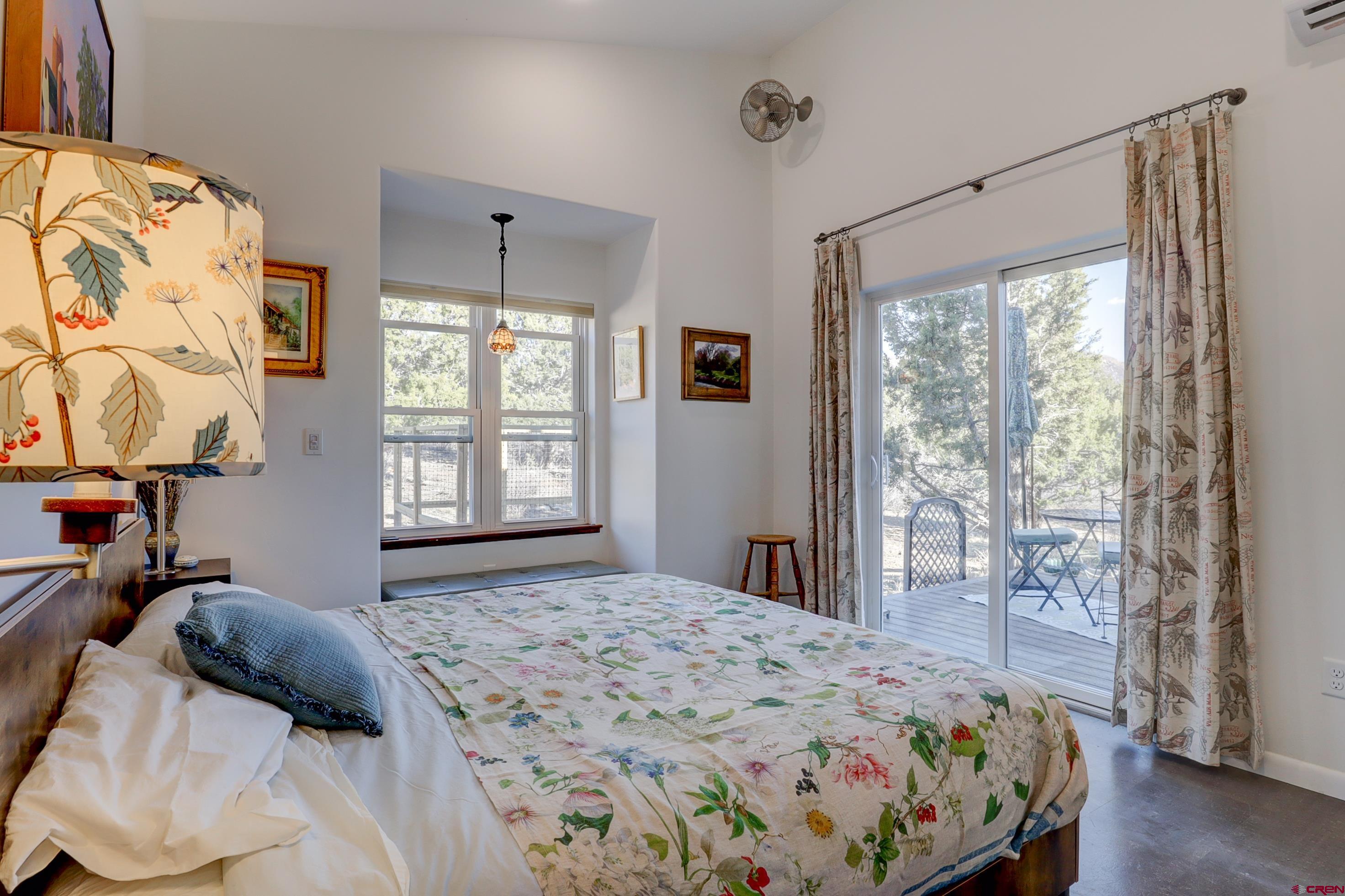 41839 Rd J.75 Mancos, CO 81328 - Photo 18 of 31 a bedroom with a large bed and a window
