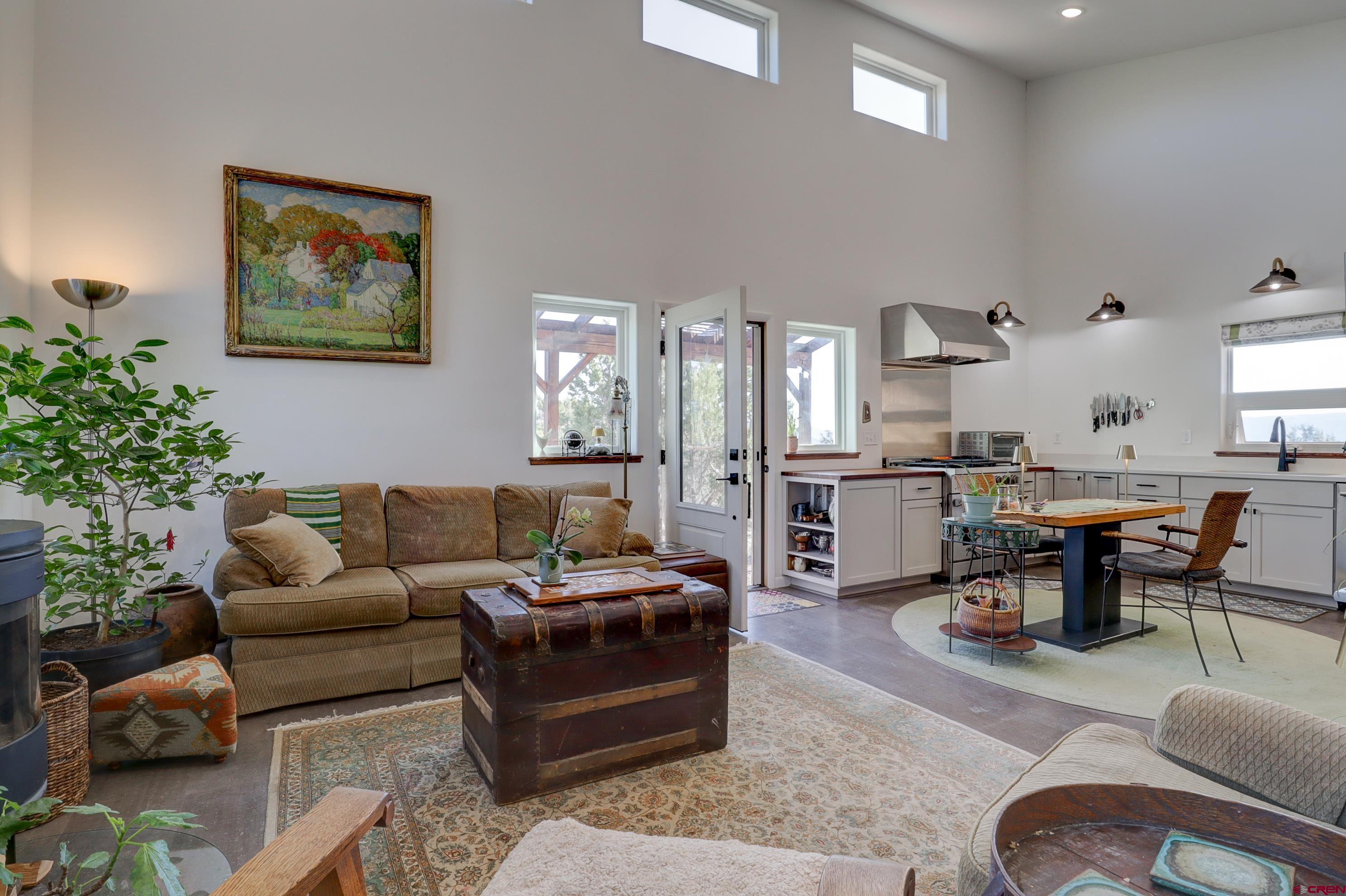 41839 Rd J.75 Mancos, CO 81328 - Photo 5 of 31 a living room with furniture kitchen view and a potted plant