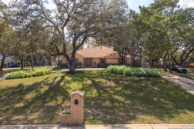 an aerial view of town with residential houses with outdoor space and trees