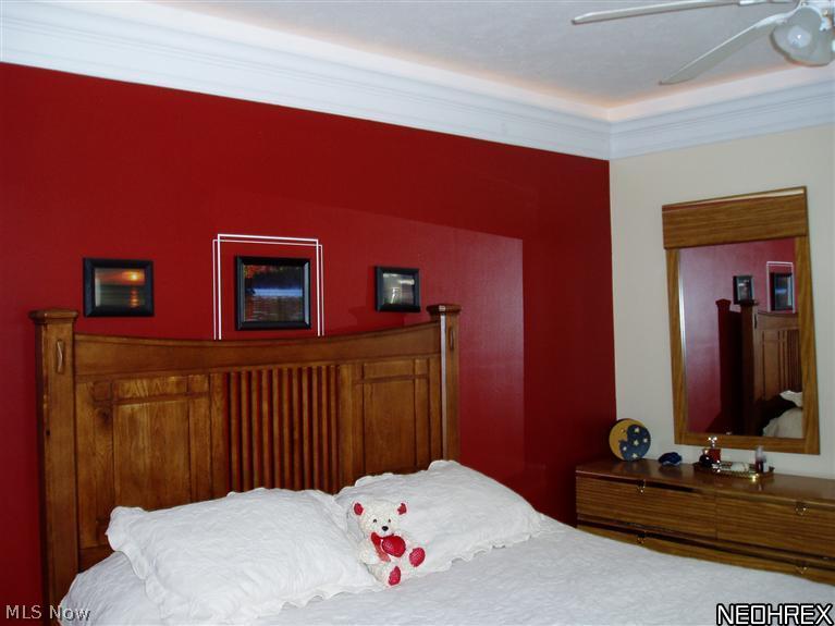 3857 South Ridge Road Perry, OH 44081 - Photo 8 of 25 A first floor master with full bath and double closets has custom crown moulding and ambient lighting.