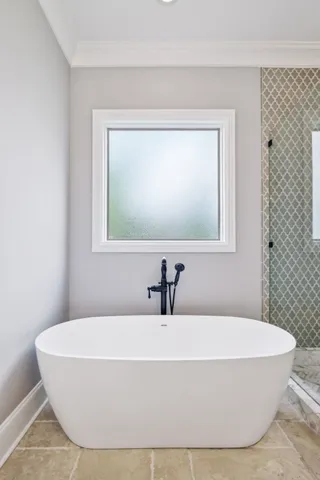 a bathroom with a bathtub and a sink