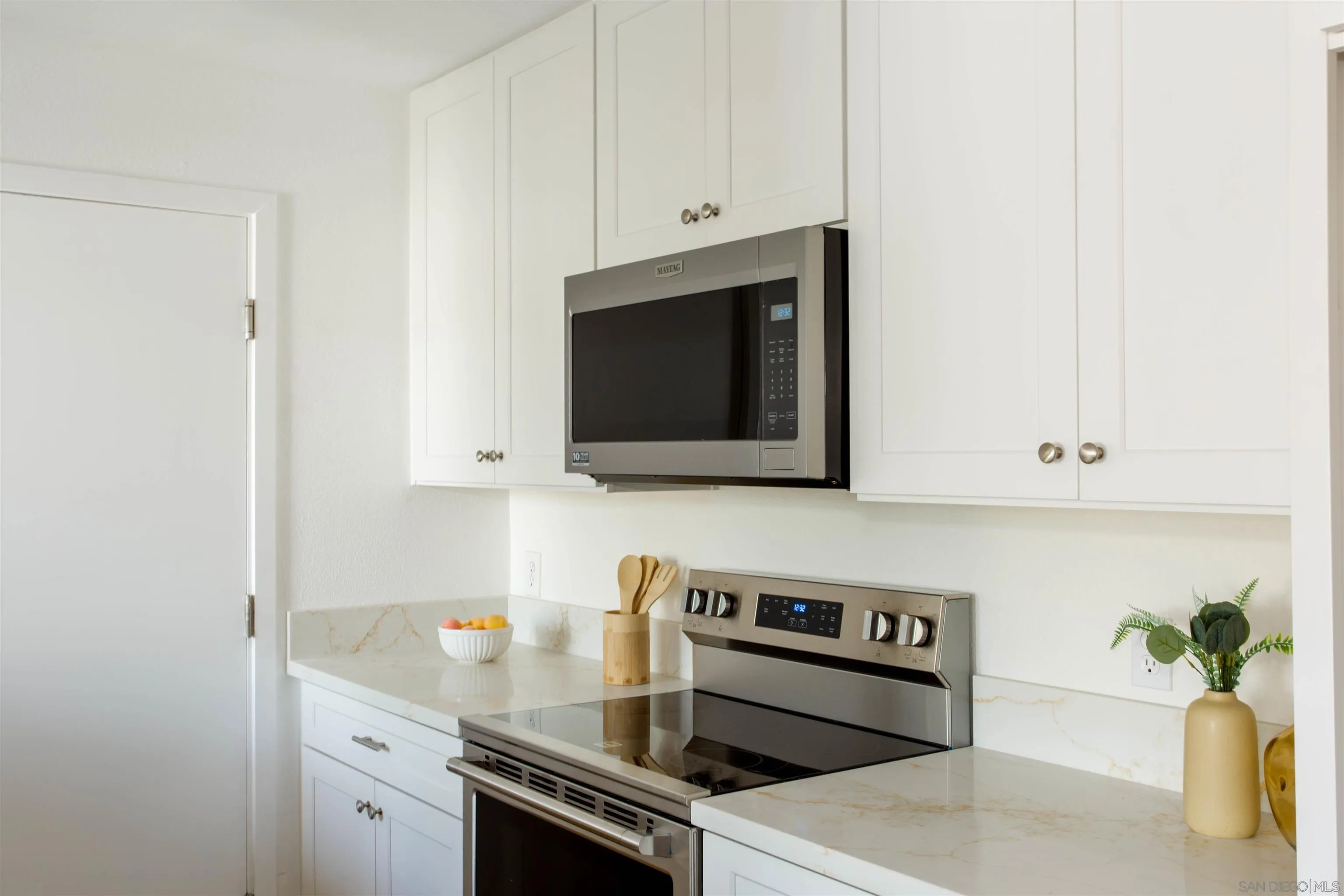 13650 Mulberry Tree Court Poway, CA 92064 - Photo 11 of 26 a kitchen with a stove and a microwave
