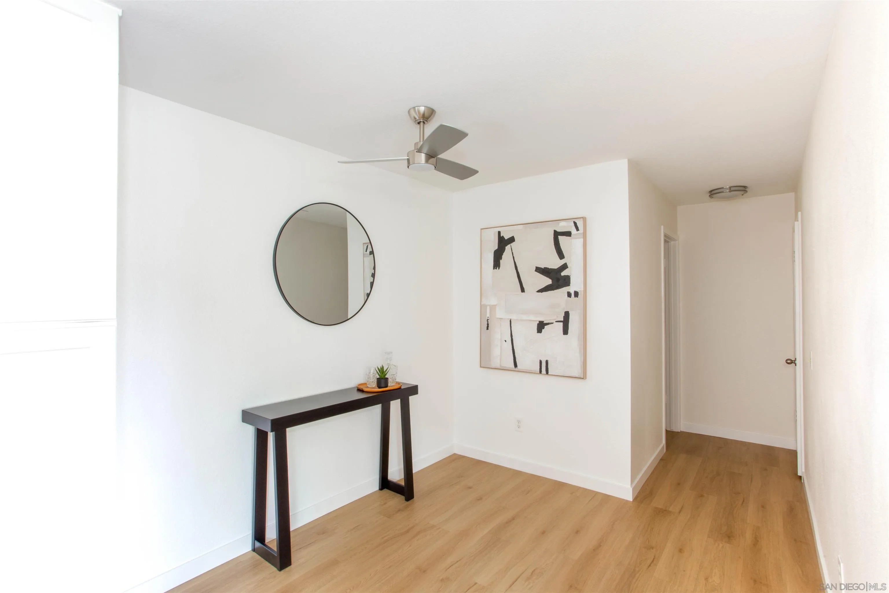 13650 Mulberry Tree Court Poway, CA 92064 - Photo 12 of 26 a view of a livingroom with a bench and a mirror