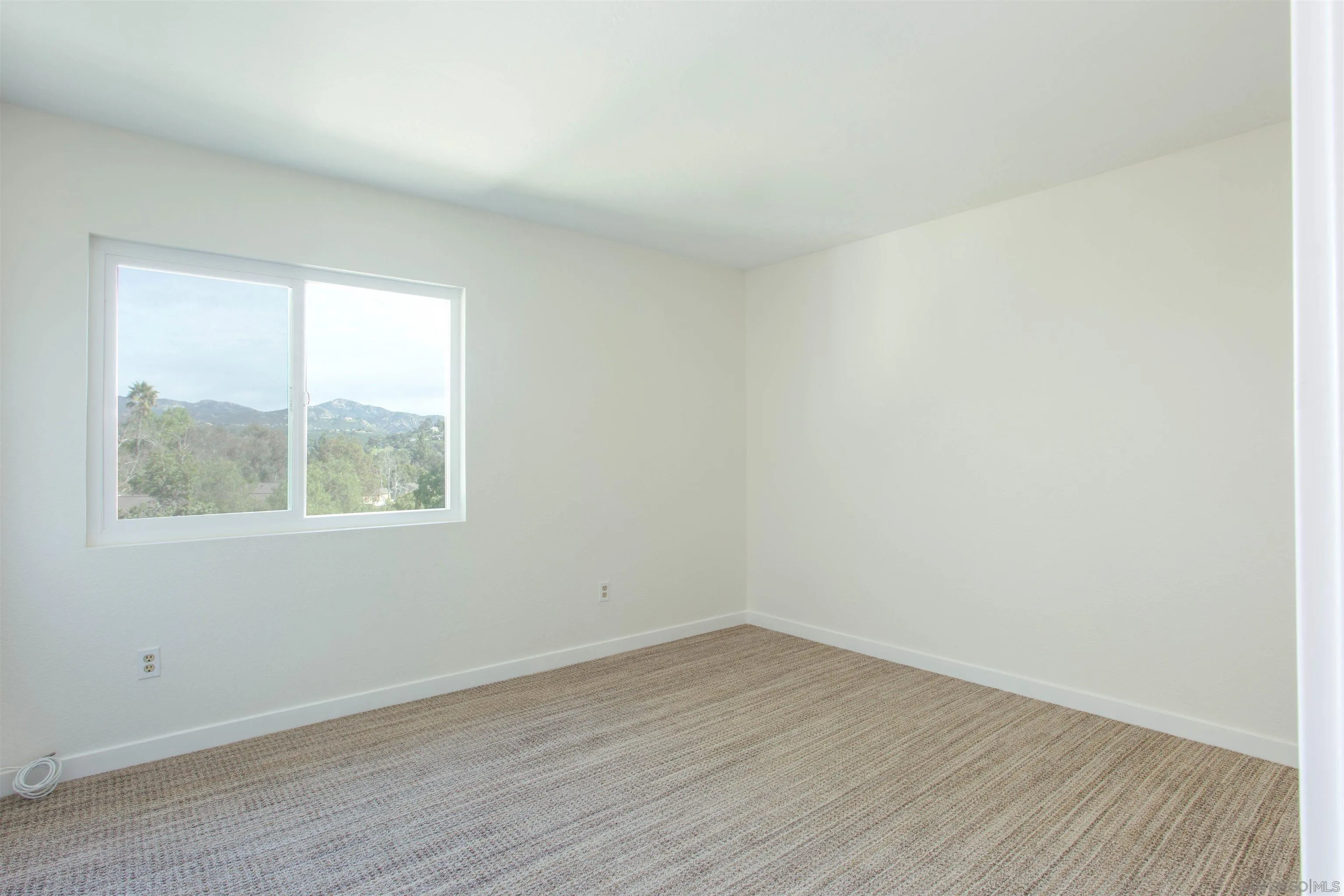 13650 Mulberry Tree Court Poway, CA 92064 - Photo 18 of 26 an empty room with wooden floor and windows
