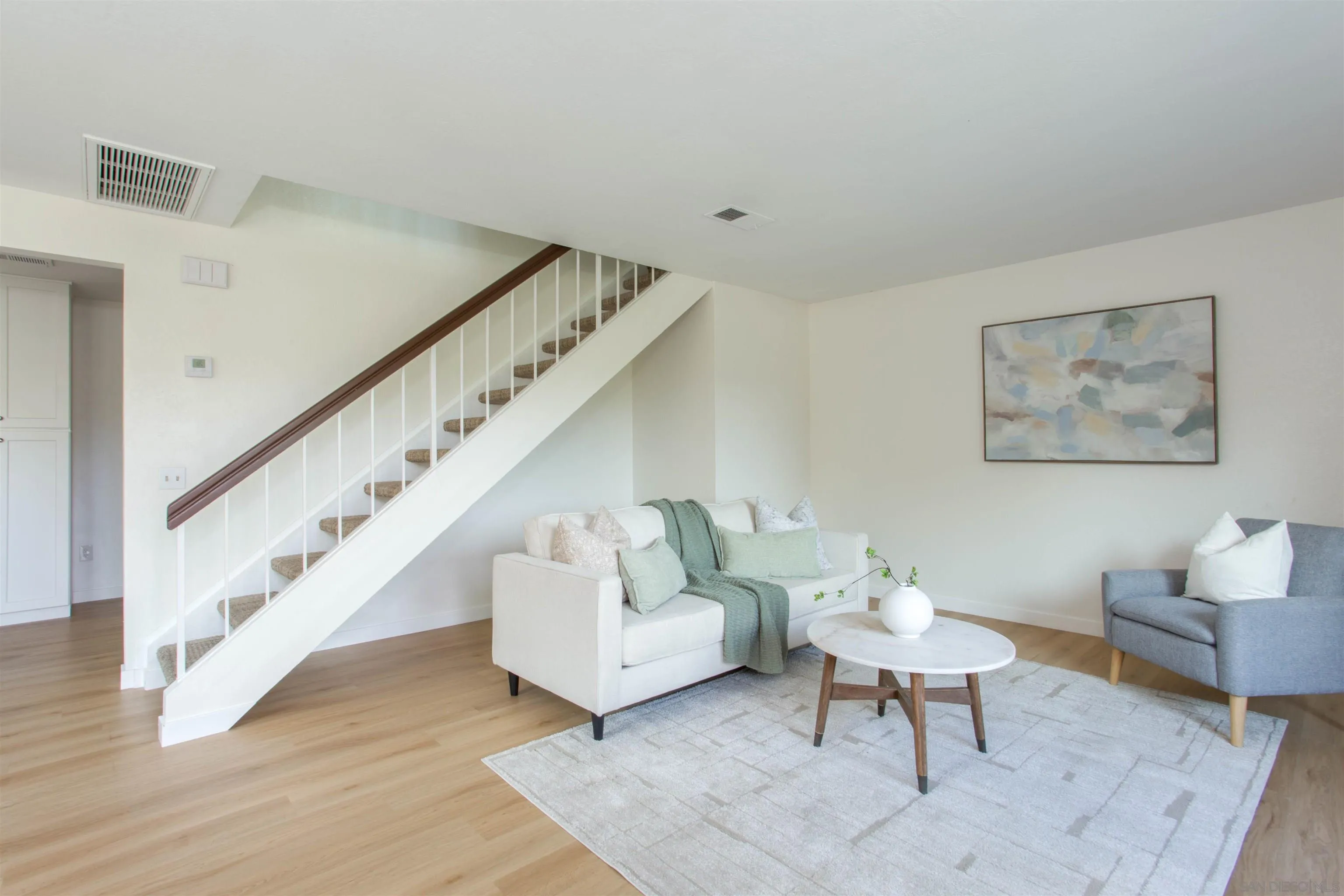 13650 Mulberry Tree Court Poway, CA 92064 - Photo 4 of 26 a living room with furniture and a stairs