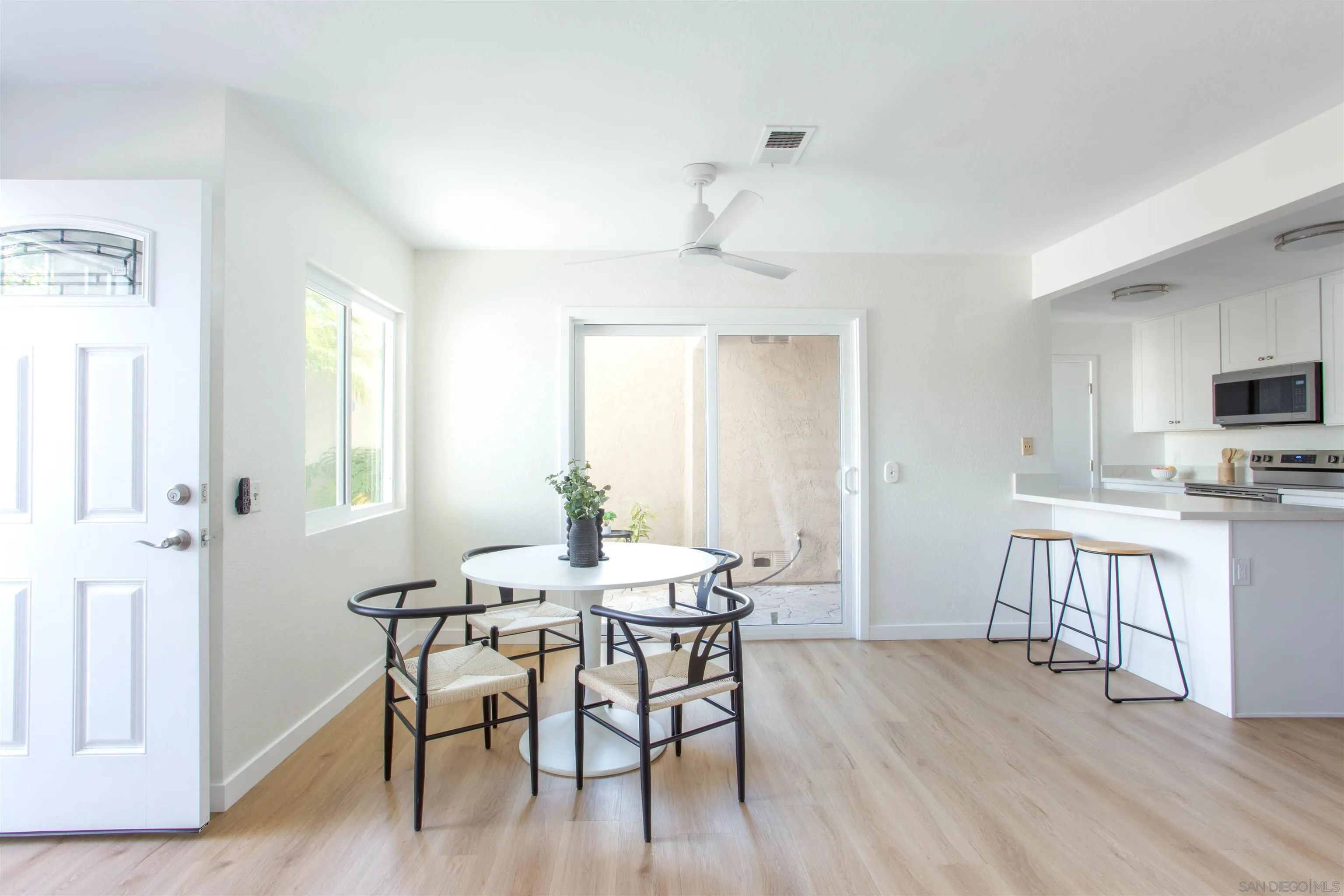 13650 Mulberry Tree Court Poway, CA 92064 - Photo 6 of 26 a view of a dining room with furniture and wooden floor
