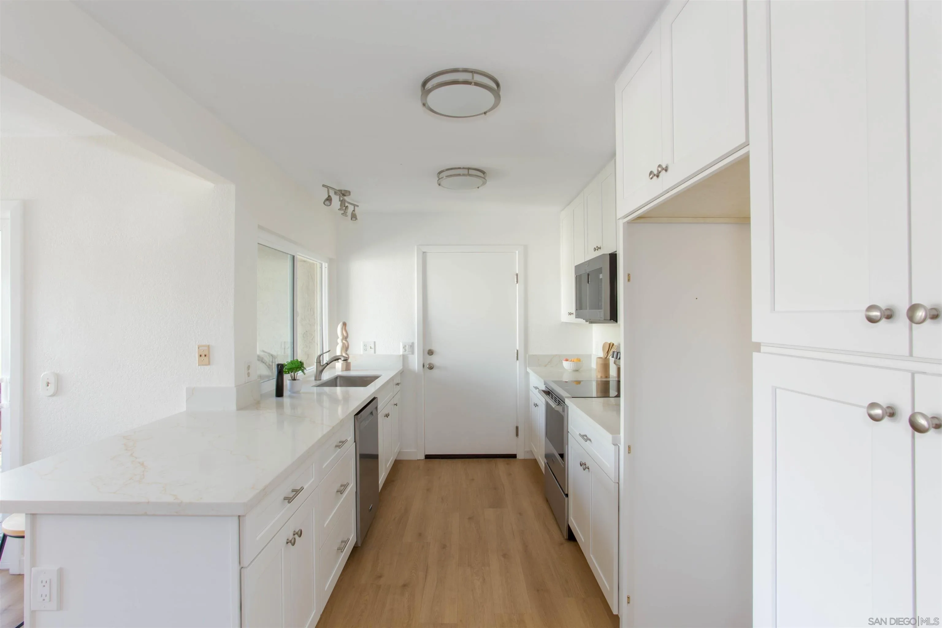 13650 Mulberry Tree Court Poway, CA 92064 - Photo 10 of 26 a spacious bathroom with a double vanity sink and a mirror