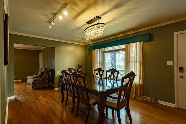 a view of a dining room with furniture window and outside view